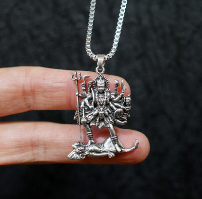 Close-up of 1.5 inch Kali pendant showing trident and detailed form