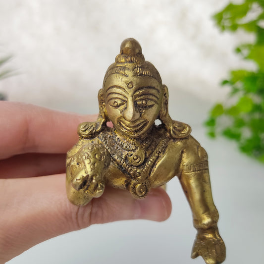 brass krishna god statue laddhu
